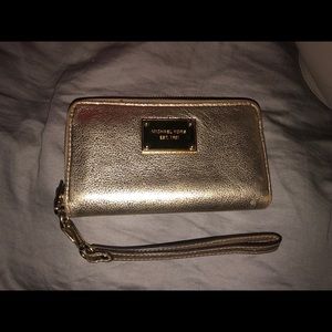 Michael Kors shiny gold wristlet